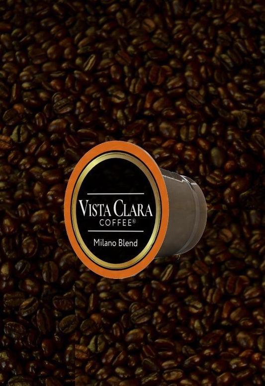 Vista Clara Coffee Milano Blend K-Cup displayed on a background of roasted coffee beans.